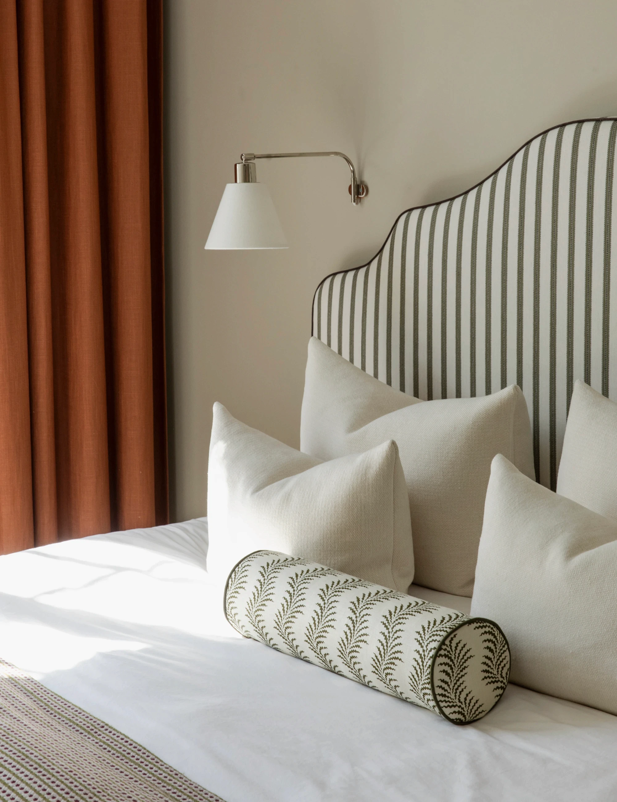 Tailored bedroom with neutral textiles